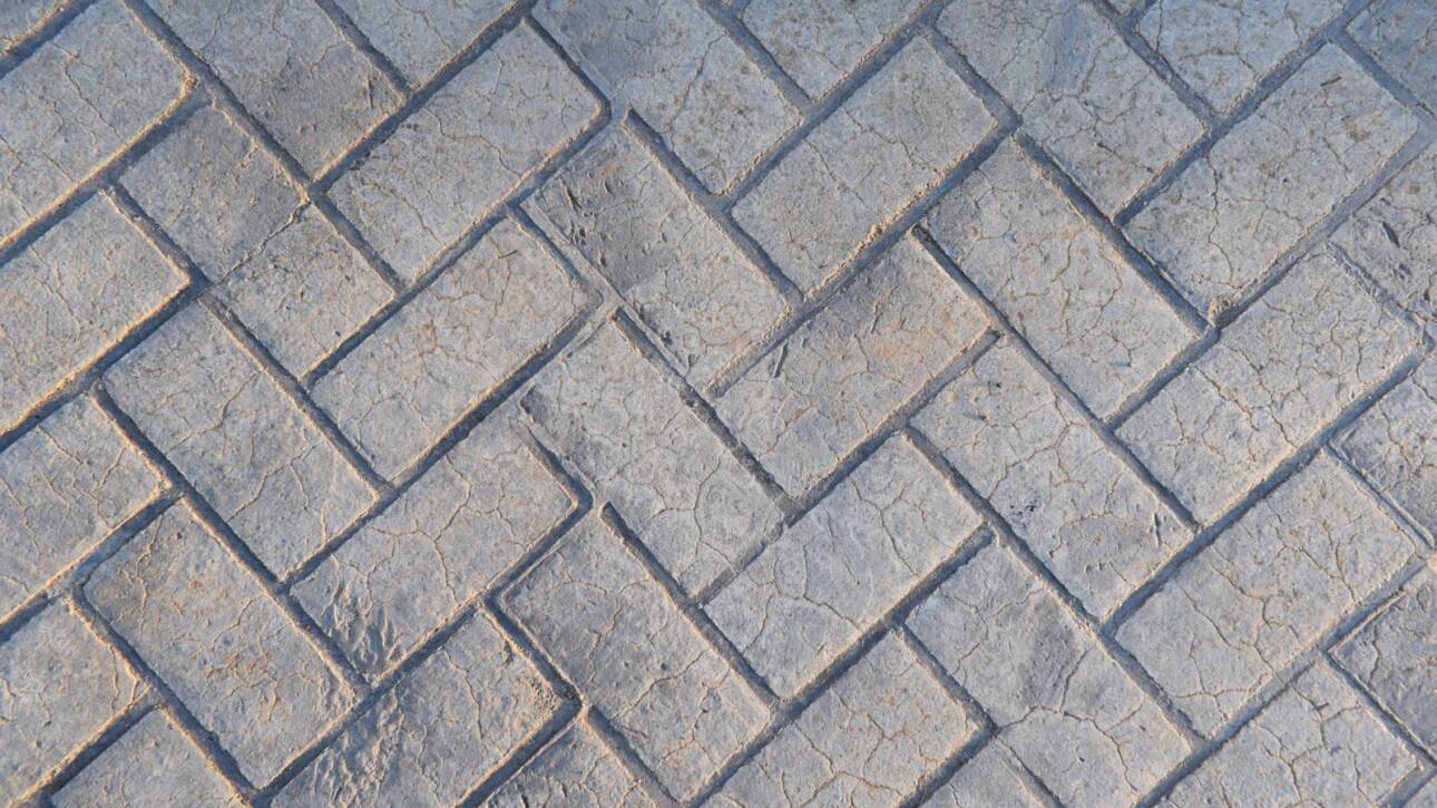 Stamped concrete made to look like gray bricks.