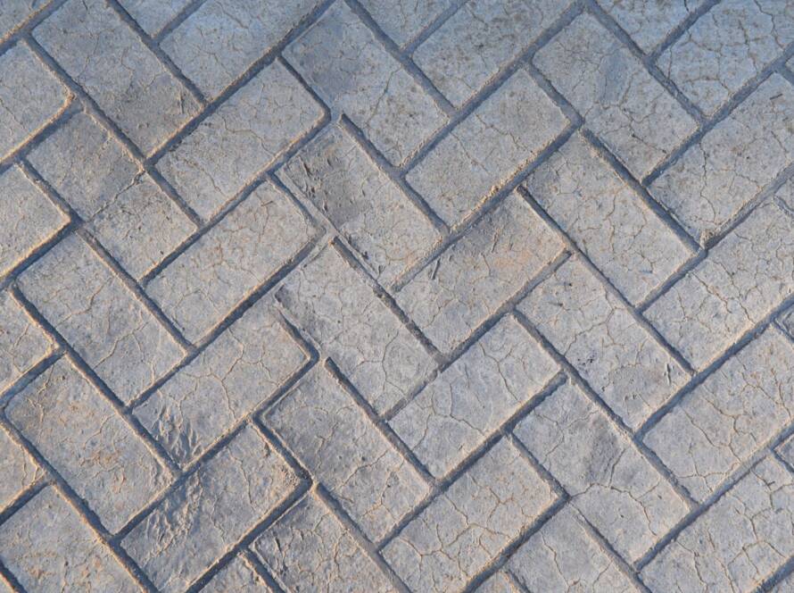Stamped concrete made to look like gray bricks.